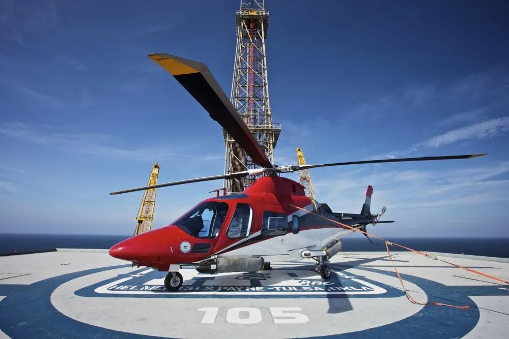 Posterazzi AgustaWestland AW109E helicopter parked on the helipad of an oil rig in the Gulf of Mexico Poster Print, (34 x 22)